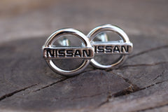 Gemelos hombre - Logo Nissan